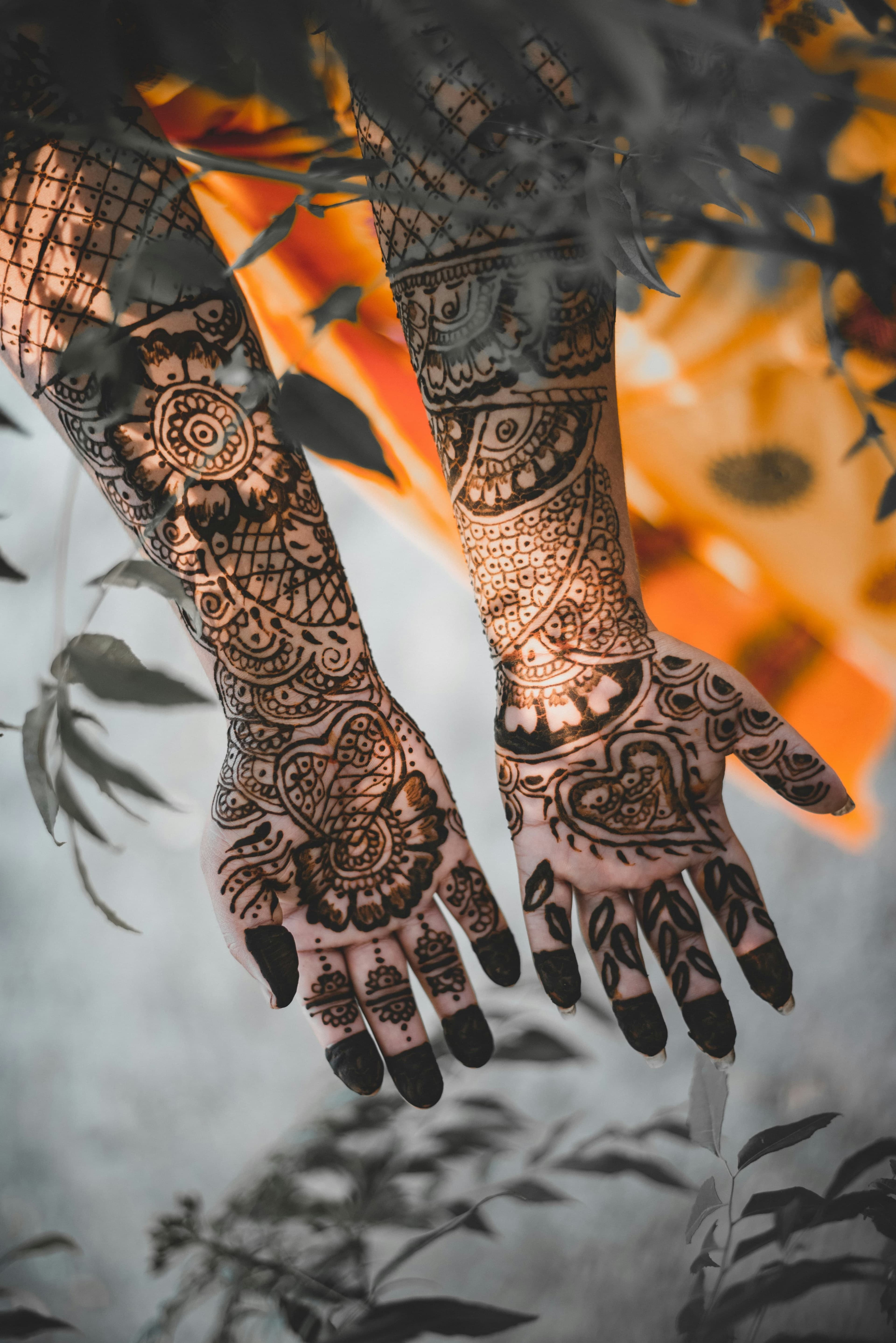 Ornamental tattoos across both hands
