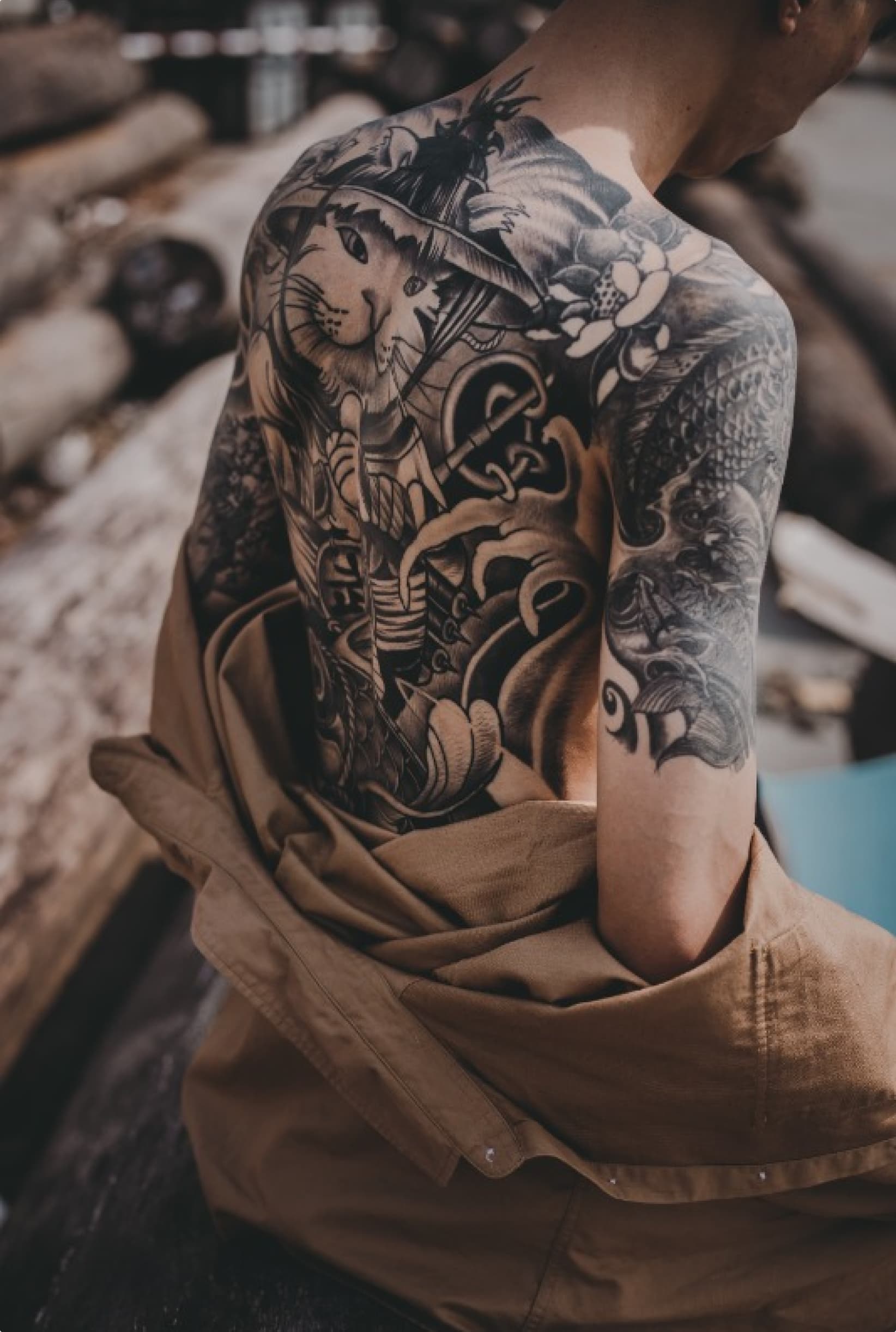 Detailed black and gray sleeve tattoo