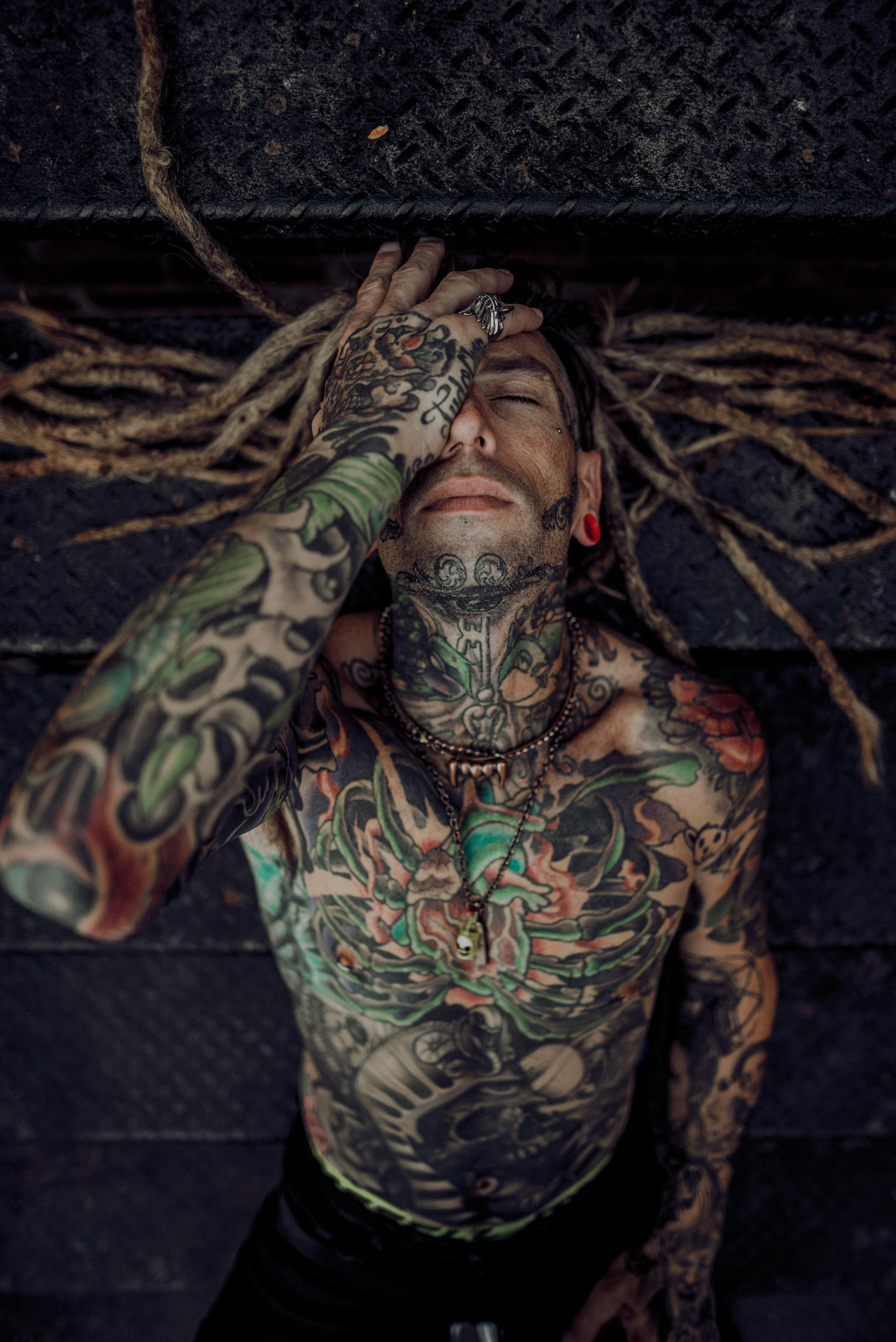 Portrait tattoo across the upper body